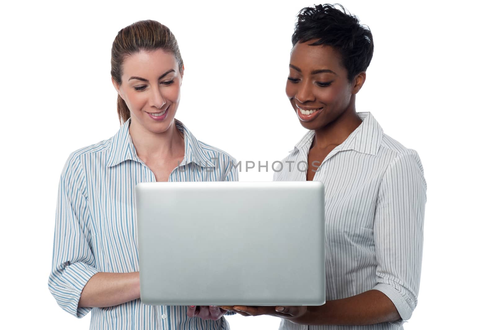 Female executives working on laptop