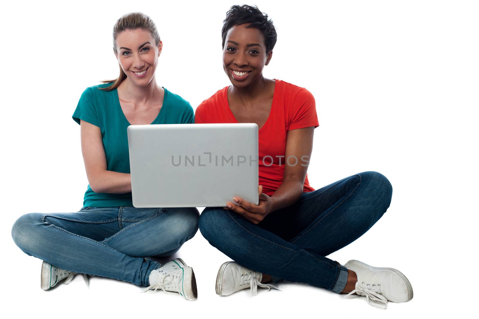 Two friends watching videos on laptop