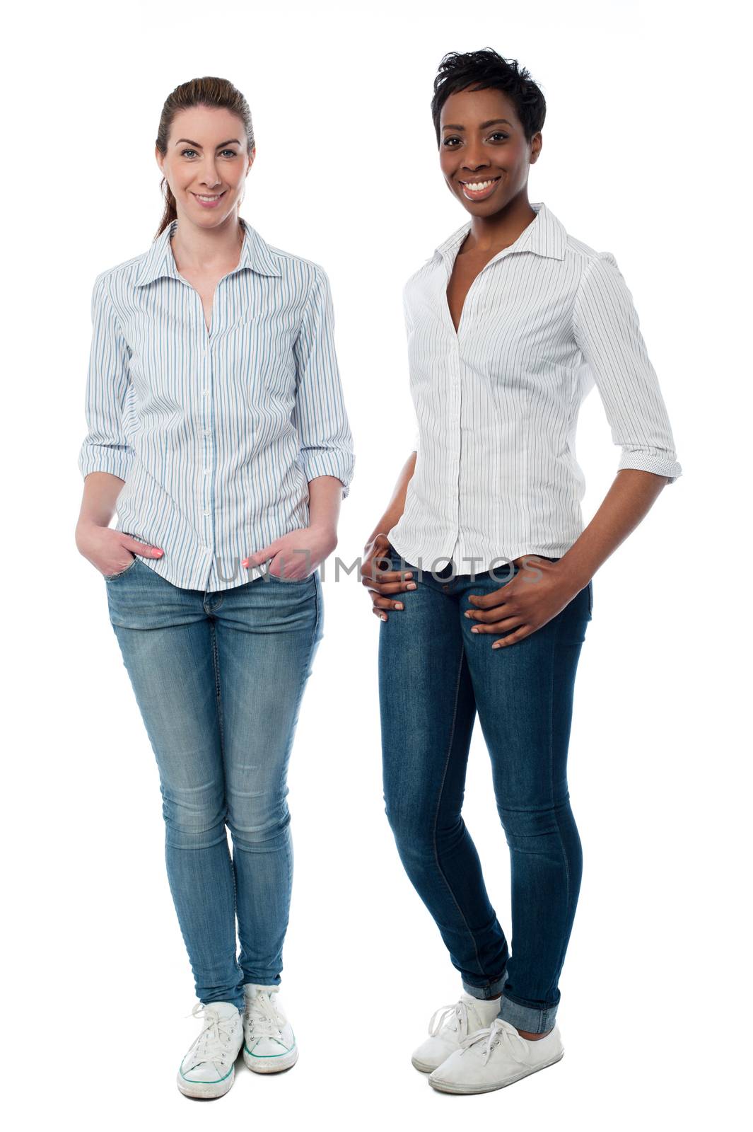 Two friendly casual women posing in style