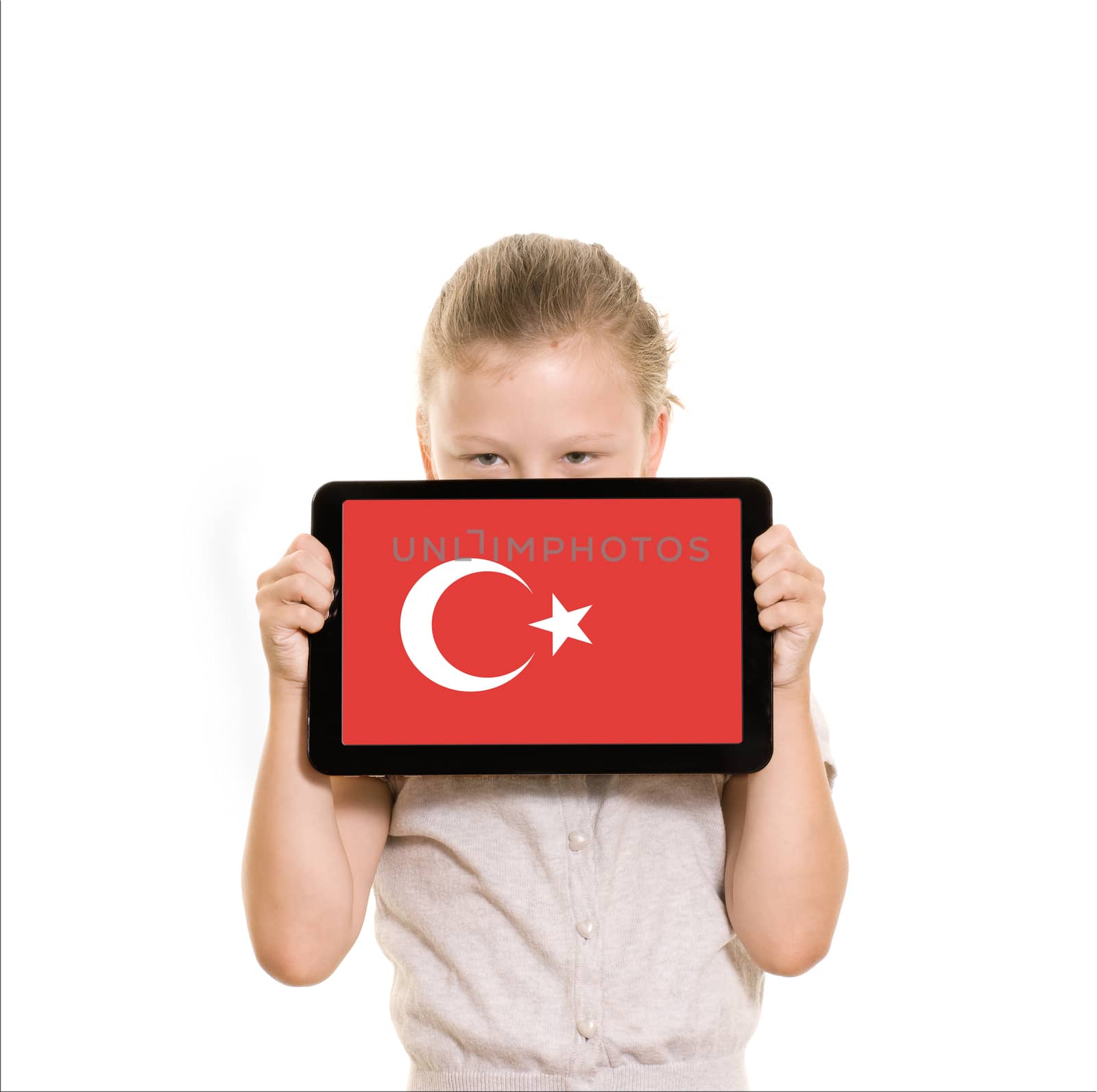 flag of Turkey displayed on tablet computer held by young girl