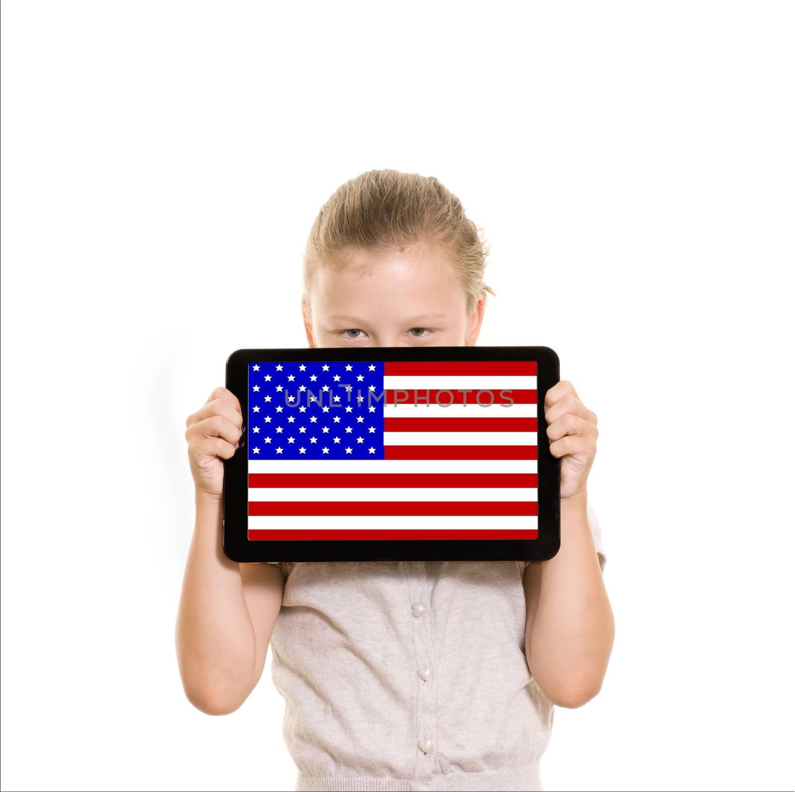 flag of USA displayed on a tablet computer held by young girl
