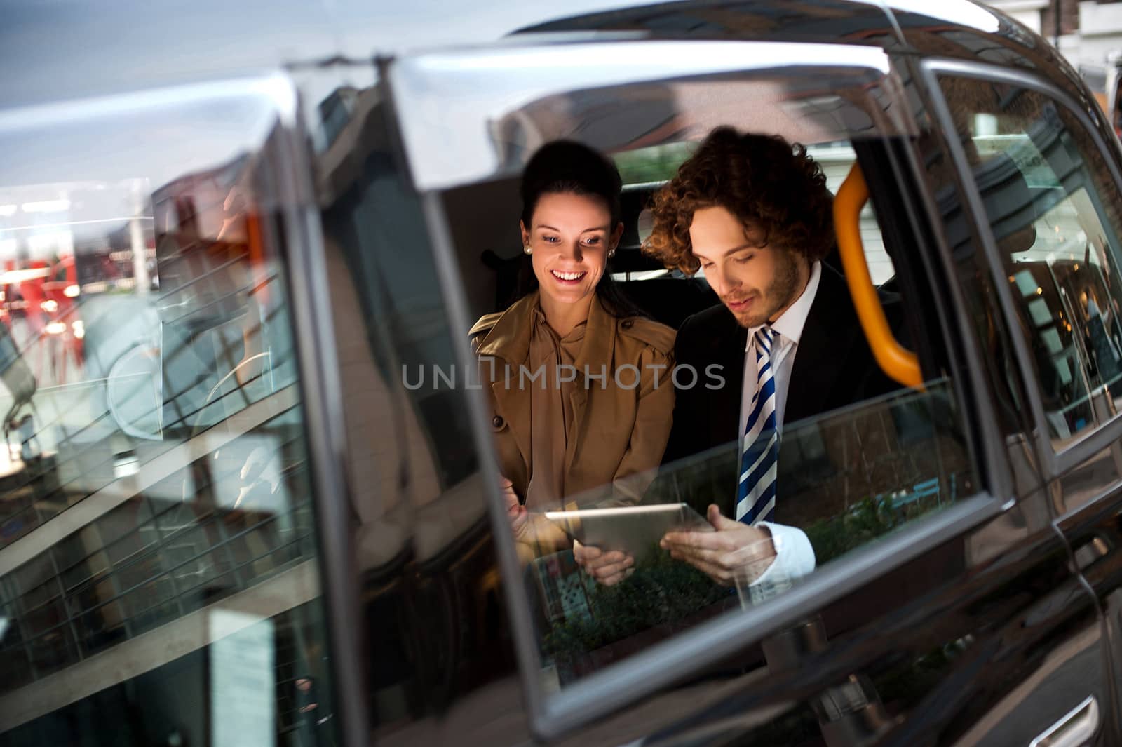 Business people in taxi cab by stockyimages