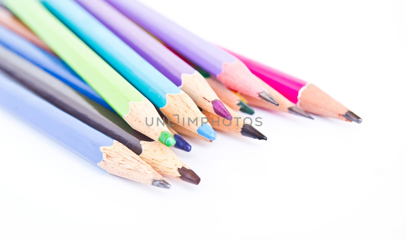 Colour pencils isolated on white background close up