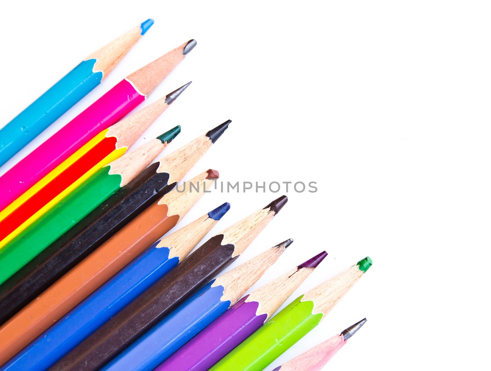 Colour pencils isolated on white background close up