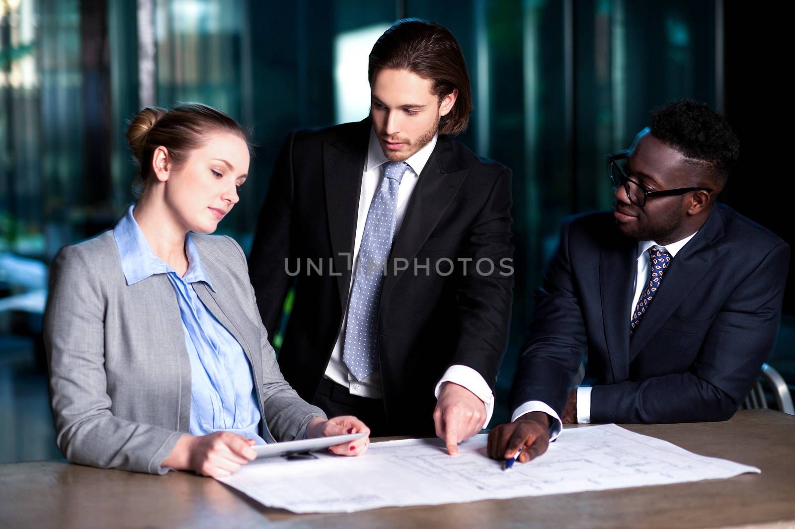 Project leader giving out guidelines to his team by stockyimages