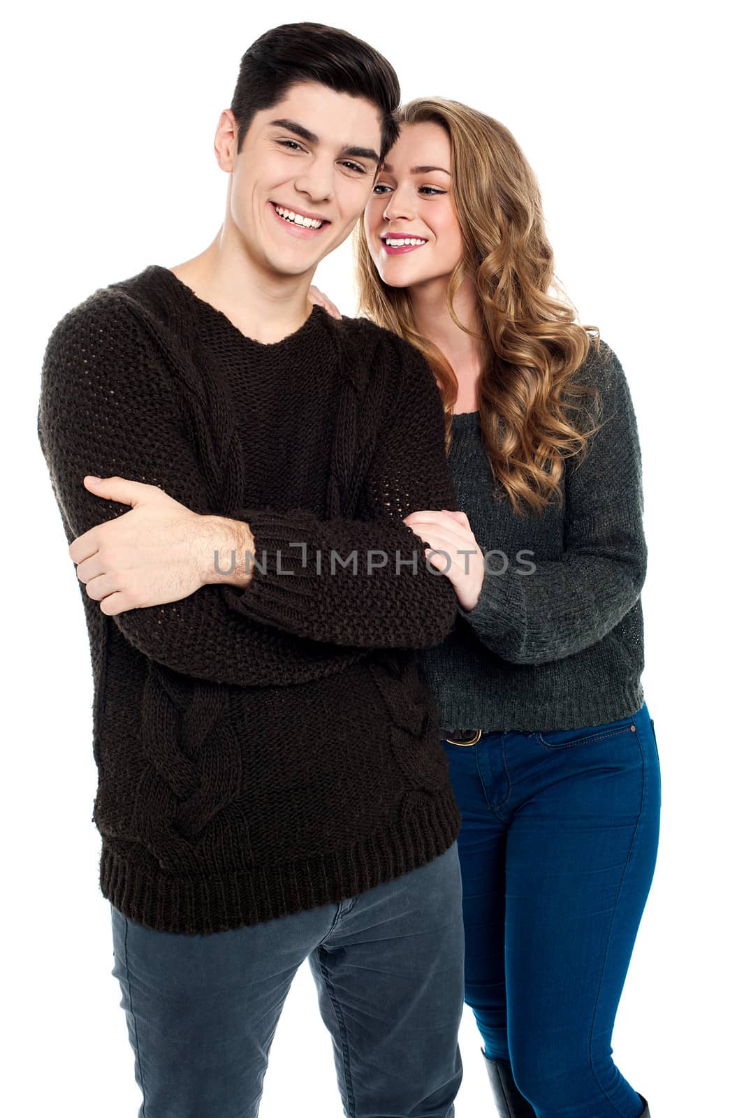 Happy romantic young couple over white background