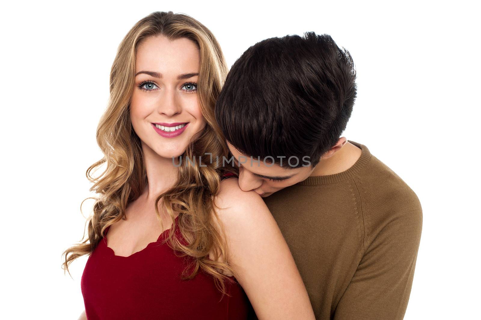 A warm kiss on girlfriends shoulder