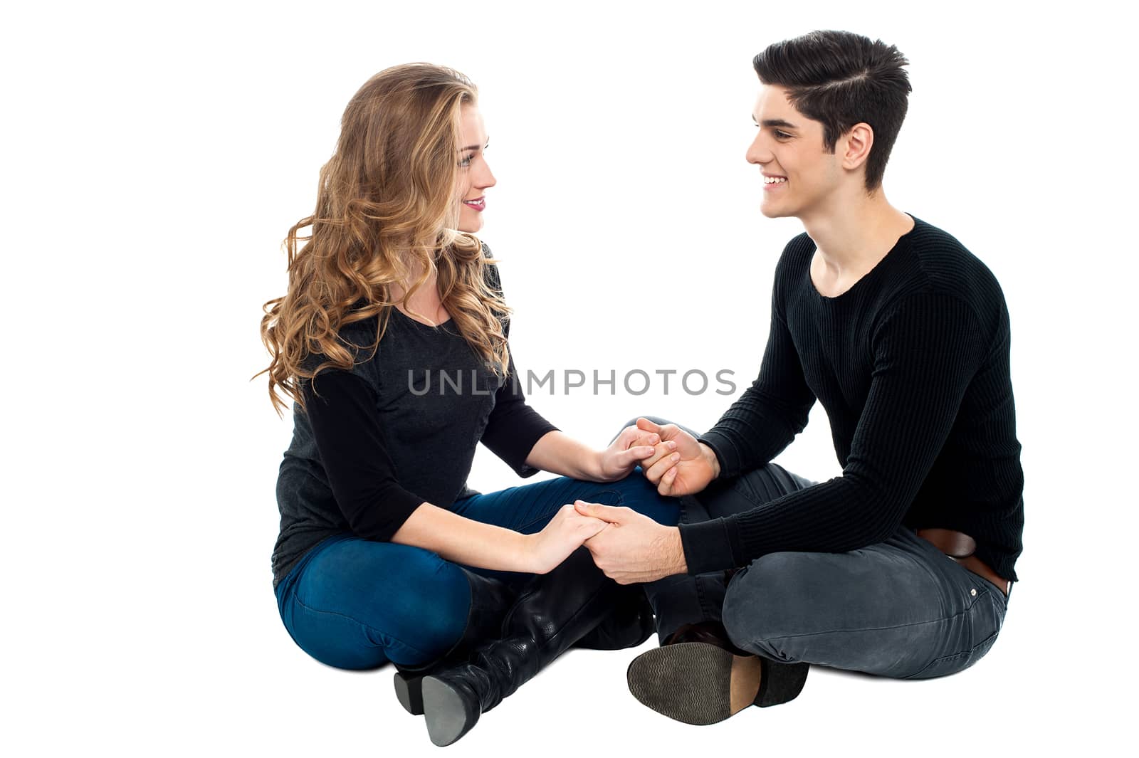Smiling couple dating and holding hands