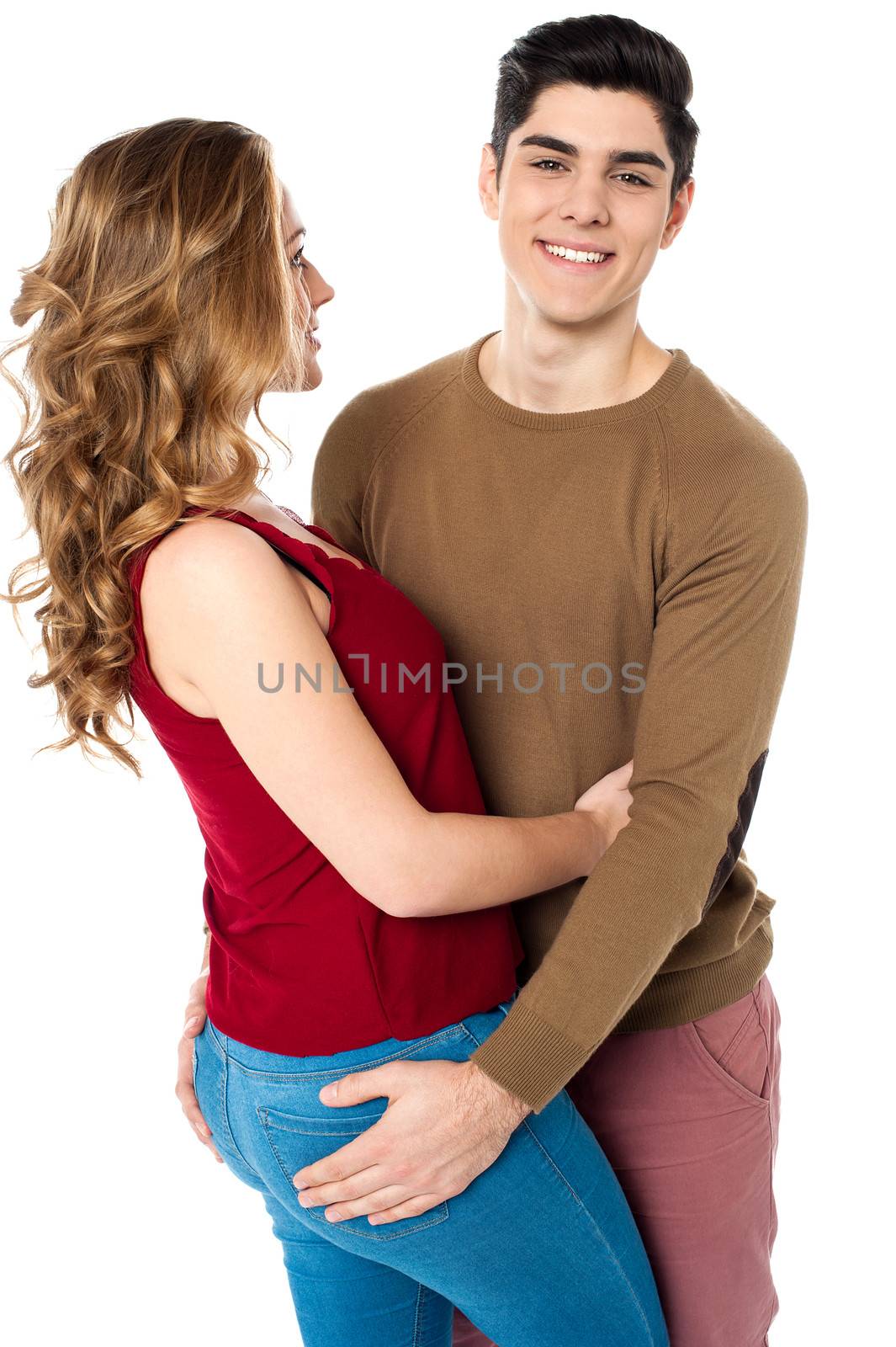 Handsome boy embracing his girlfriend