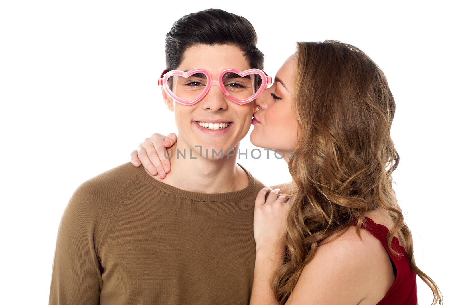 Pretty girl kissing her cute boyfriend