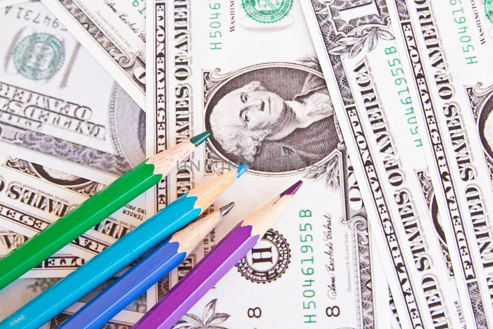 Colored pencils and background of money by den_rutchapong