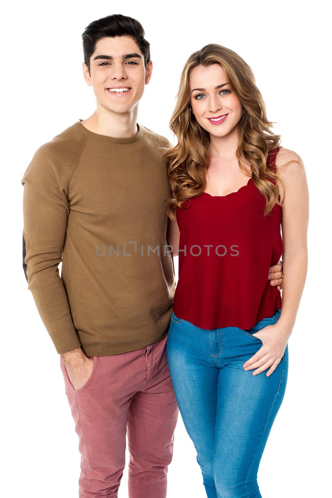 Fashionable young couple posing together by stockyimages