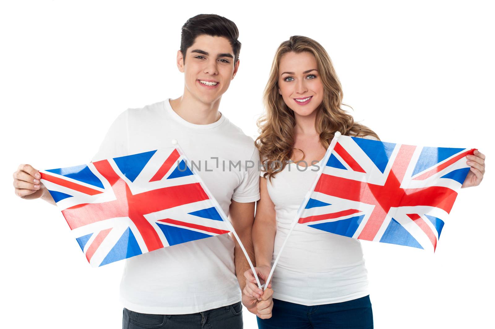 Proud young couple holding British flag