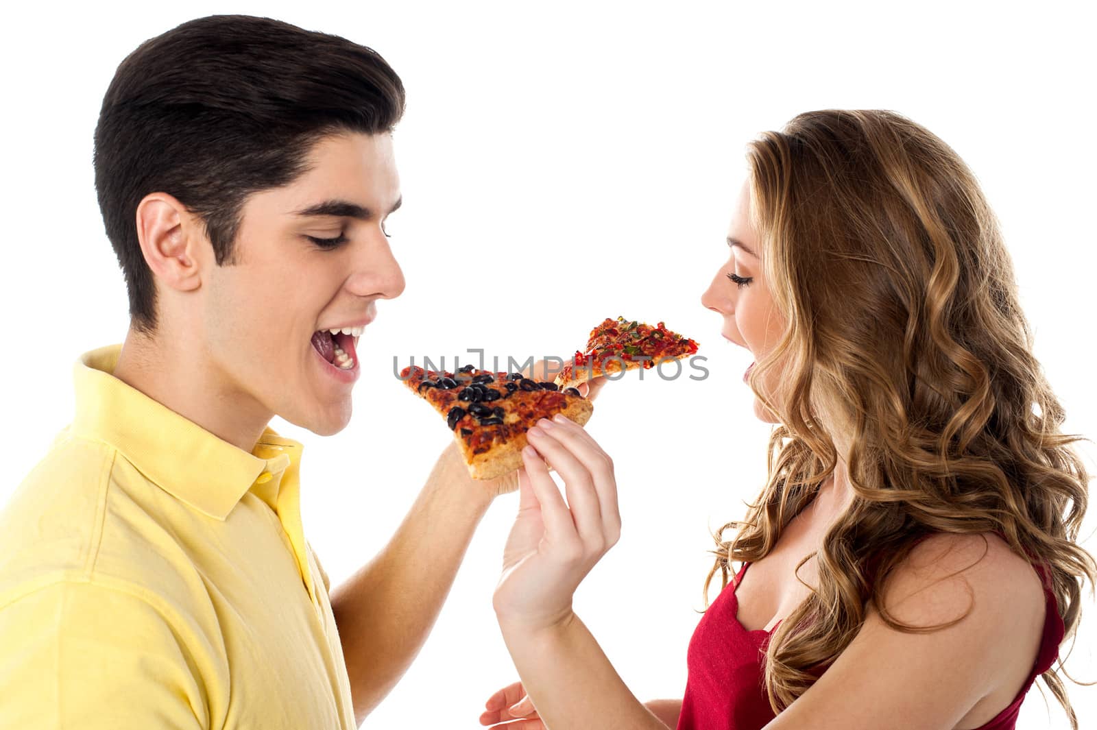 Caring couple eating pizza together