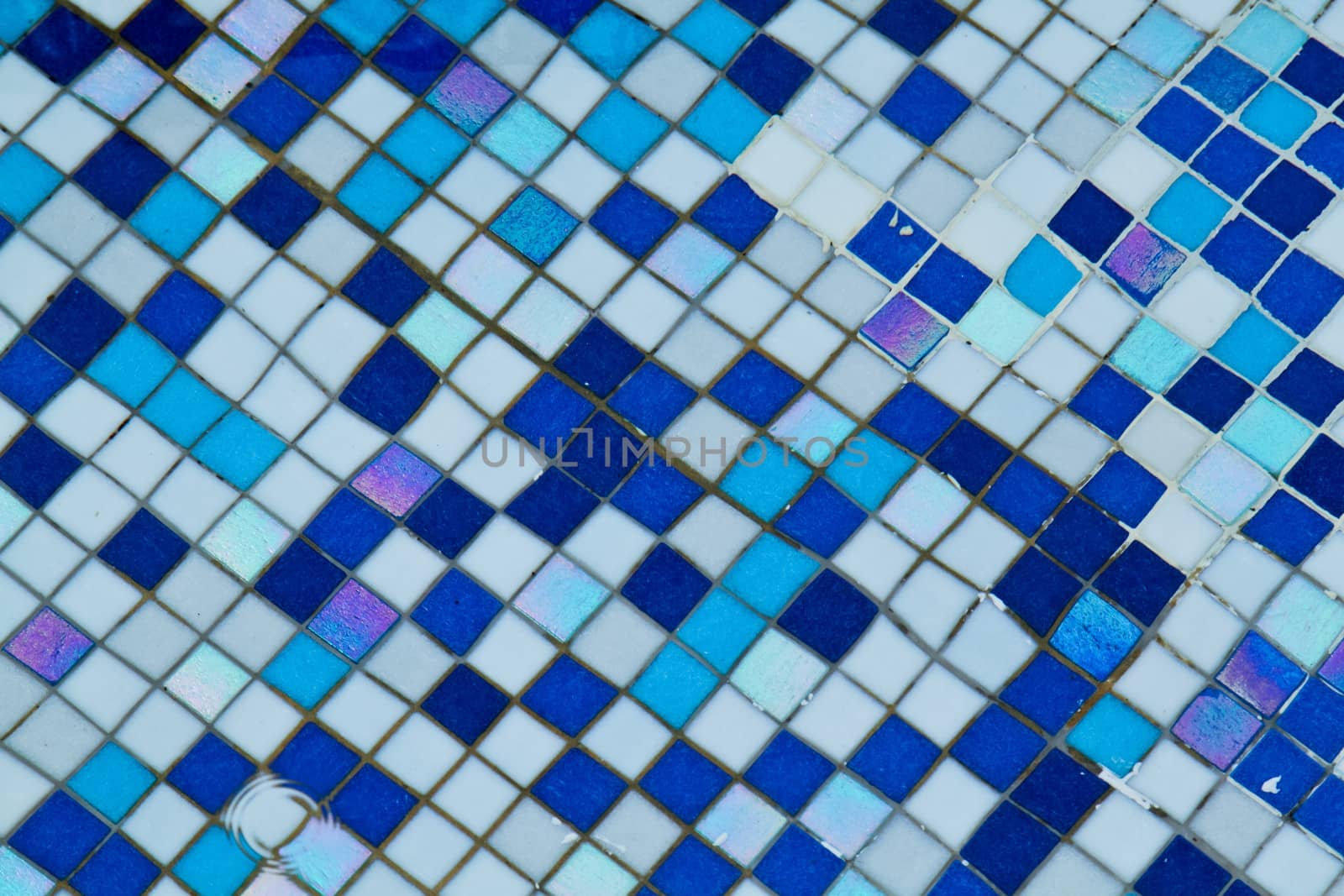Blue pool water ripple and modern brick pavement