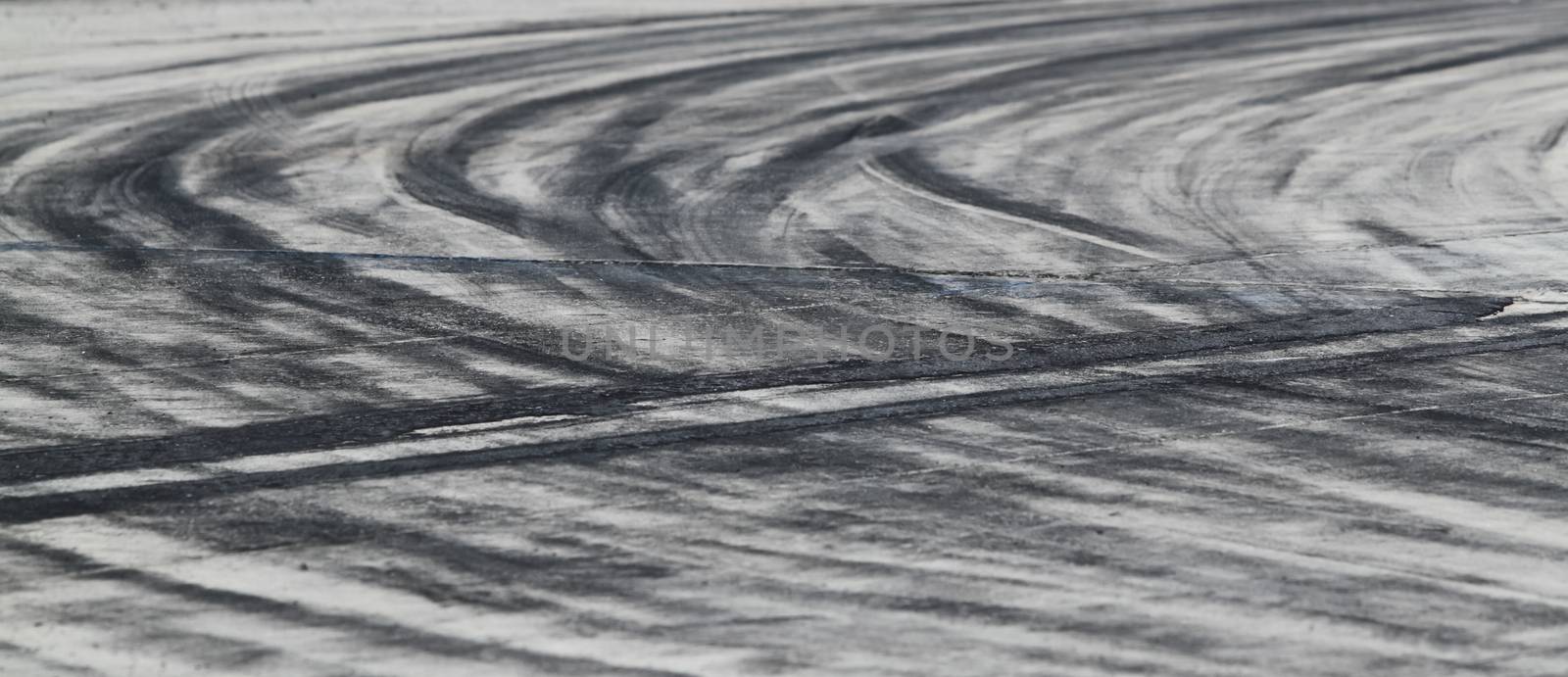 Background with tire marks on road track