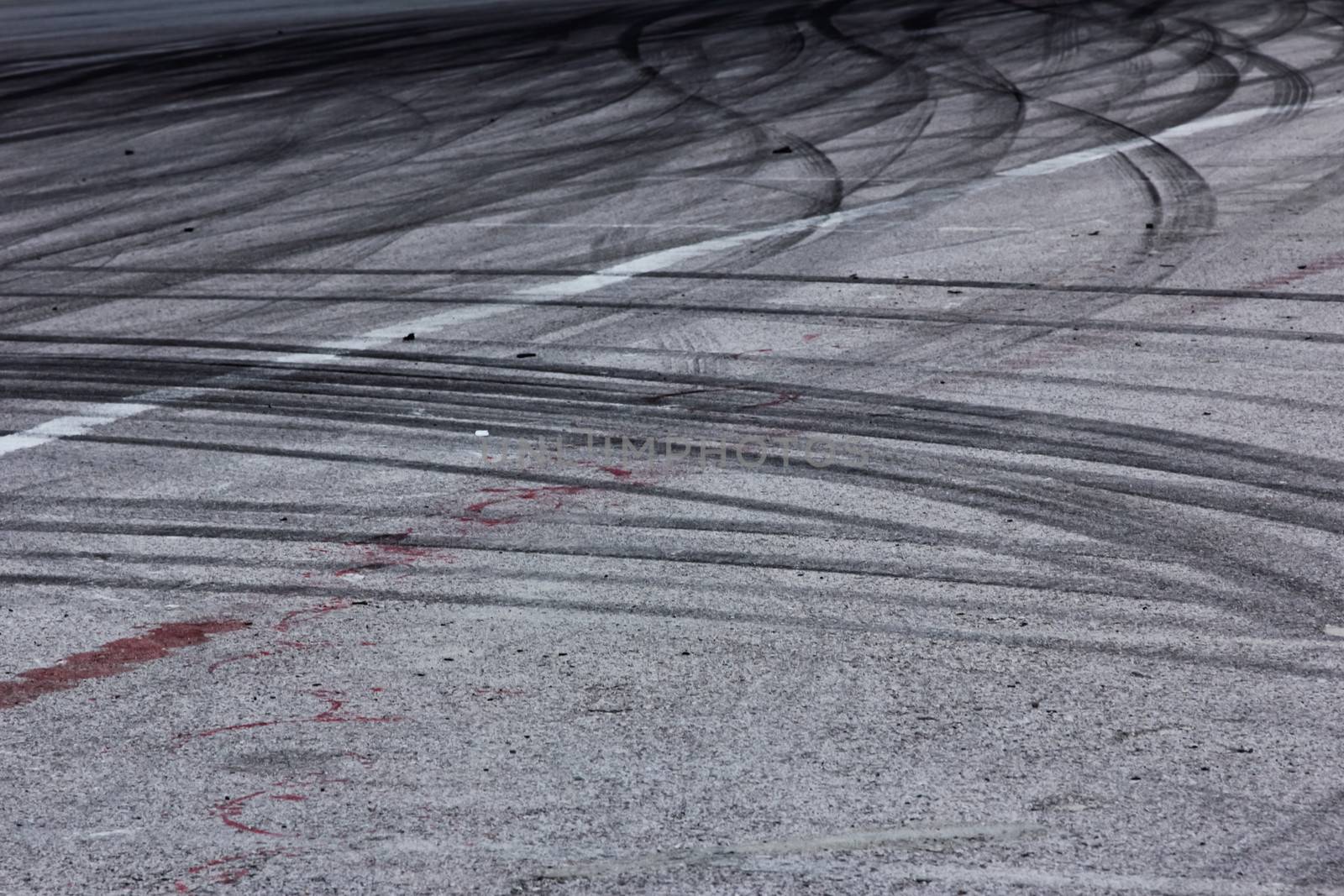Background with tire marks on road track