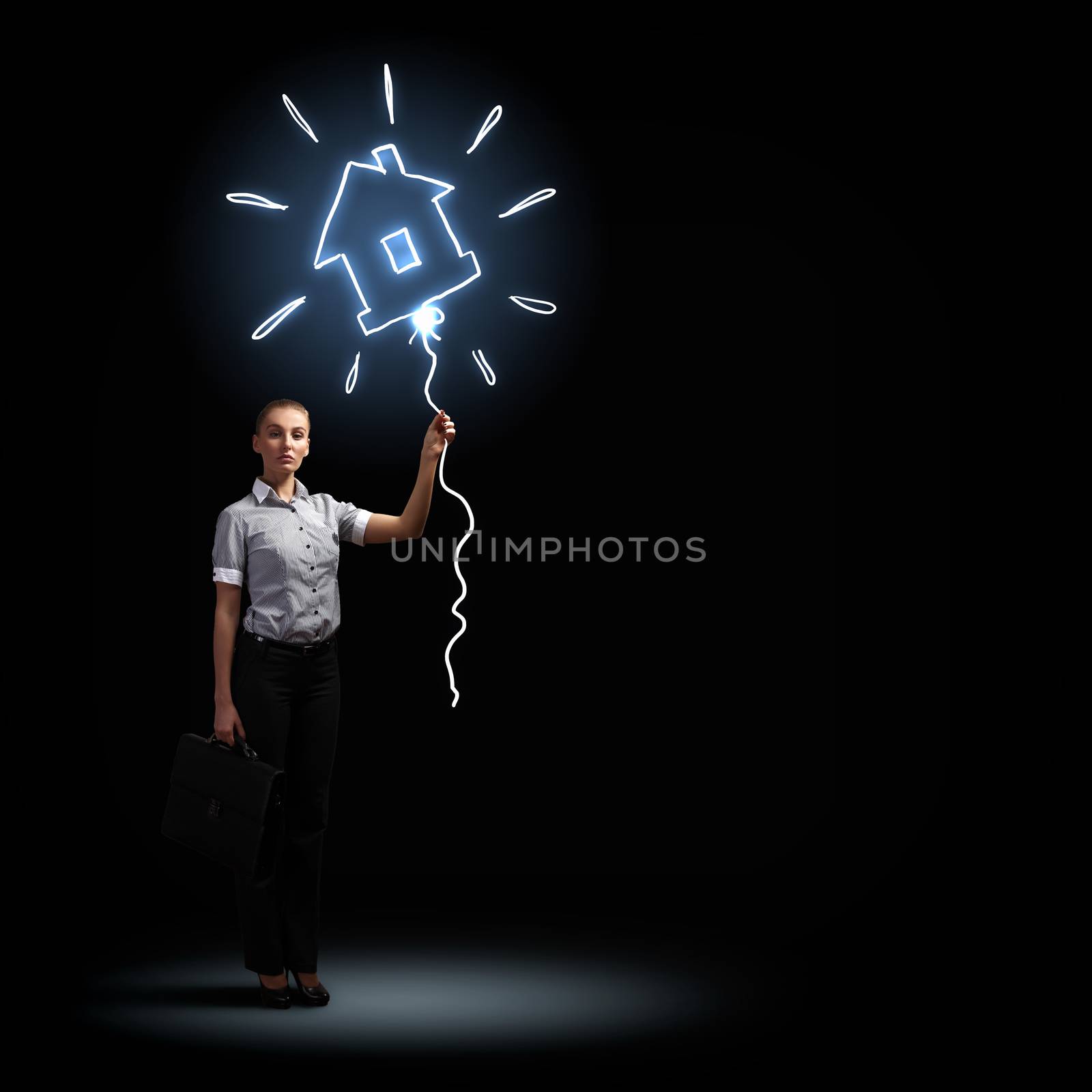 Image of attractive businesswoman against dark background