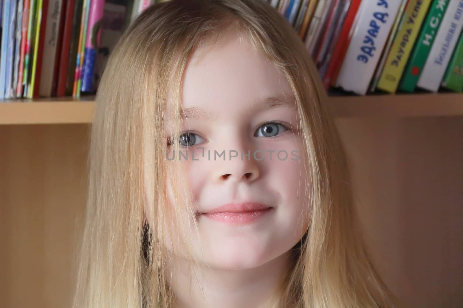 Portrait of beautiful girl on book background