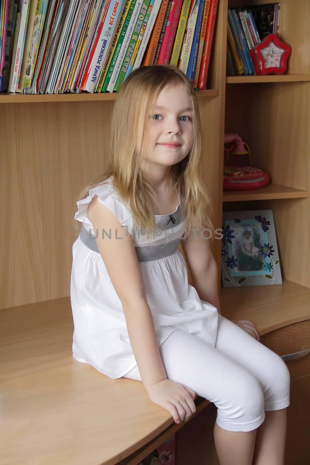 Portrait of beautiful girl on book background