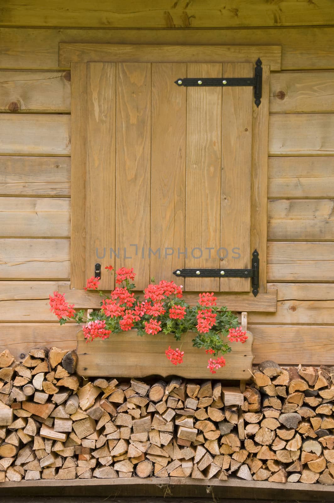 Wood balcony in a chalet in dolomites mountain