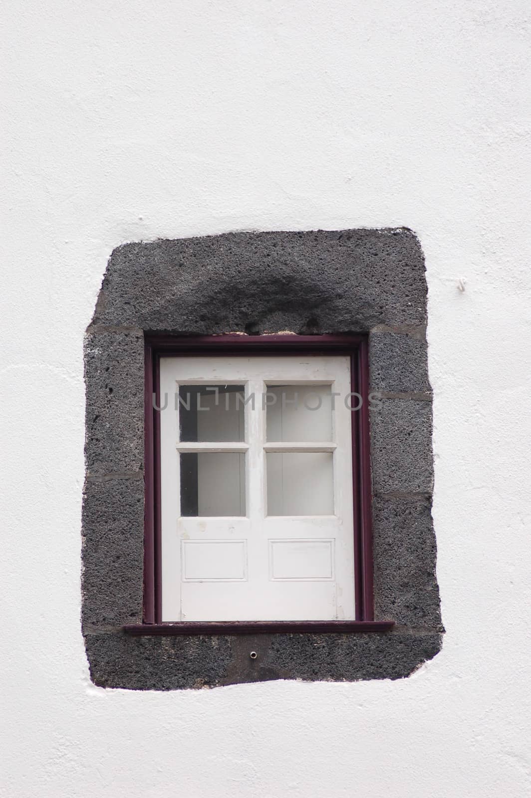 Violets small window of a house in san miguel azores