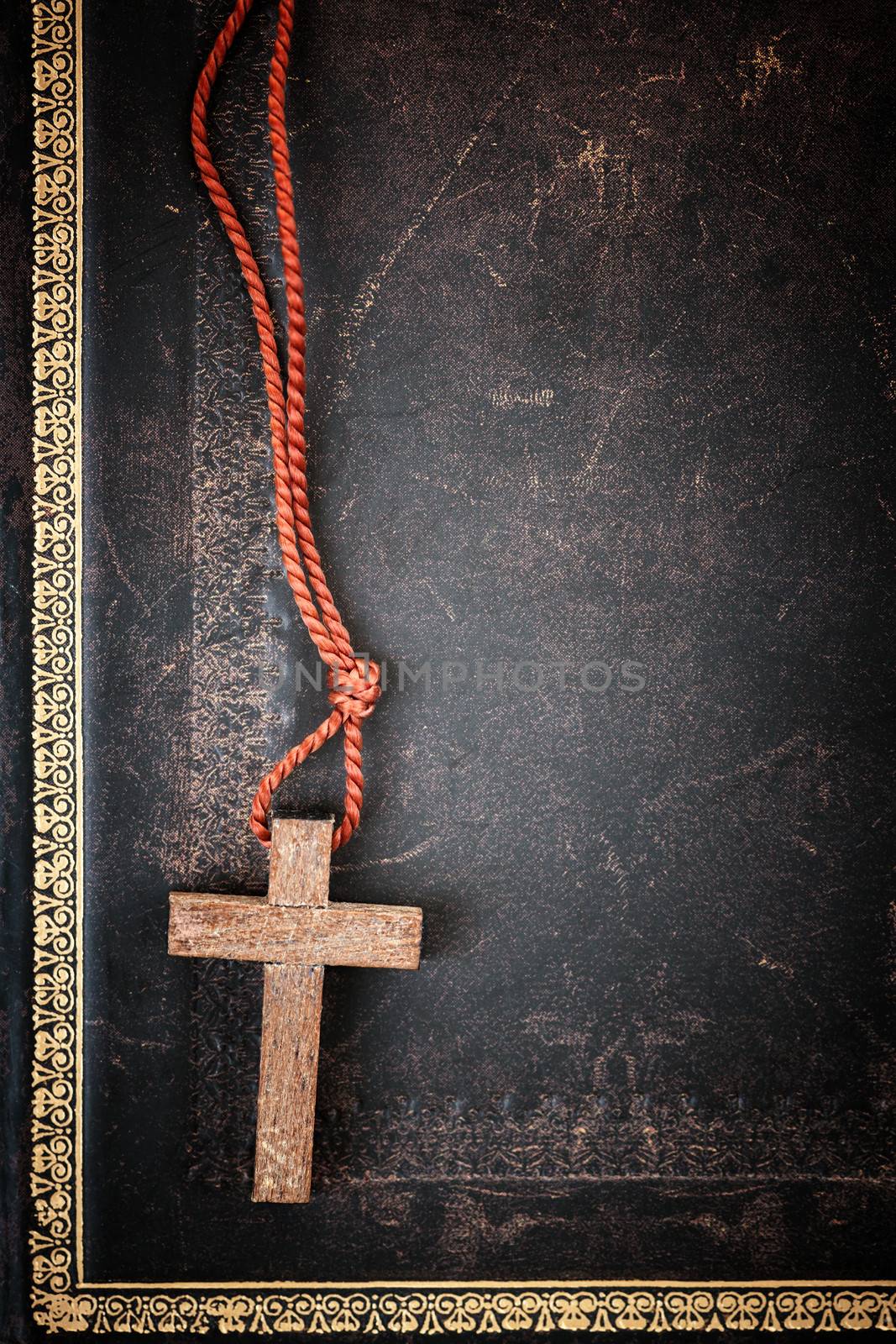 Christian Cross on Bible by elenathewise