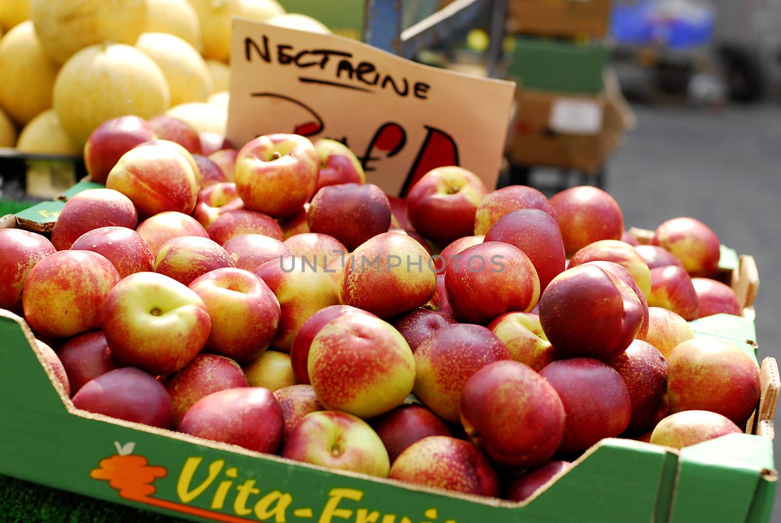 Yummy pile of apples in a market stall by stockyimages