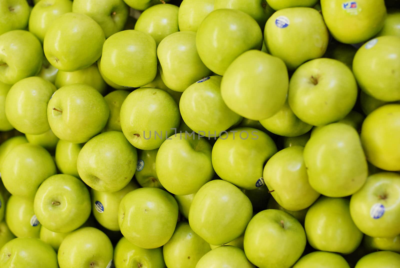 Closeup shot of green apples for sale at a marketplace