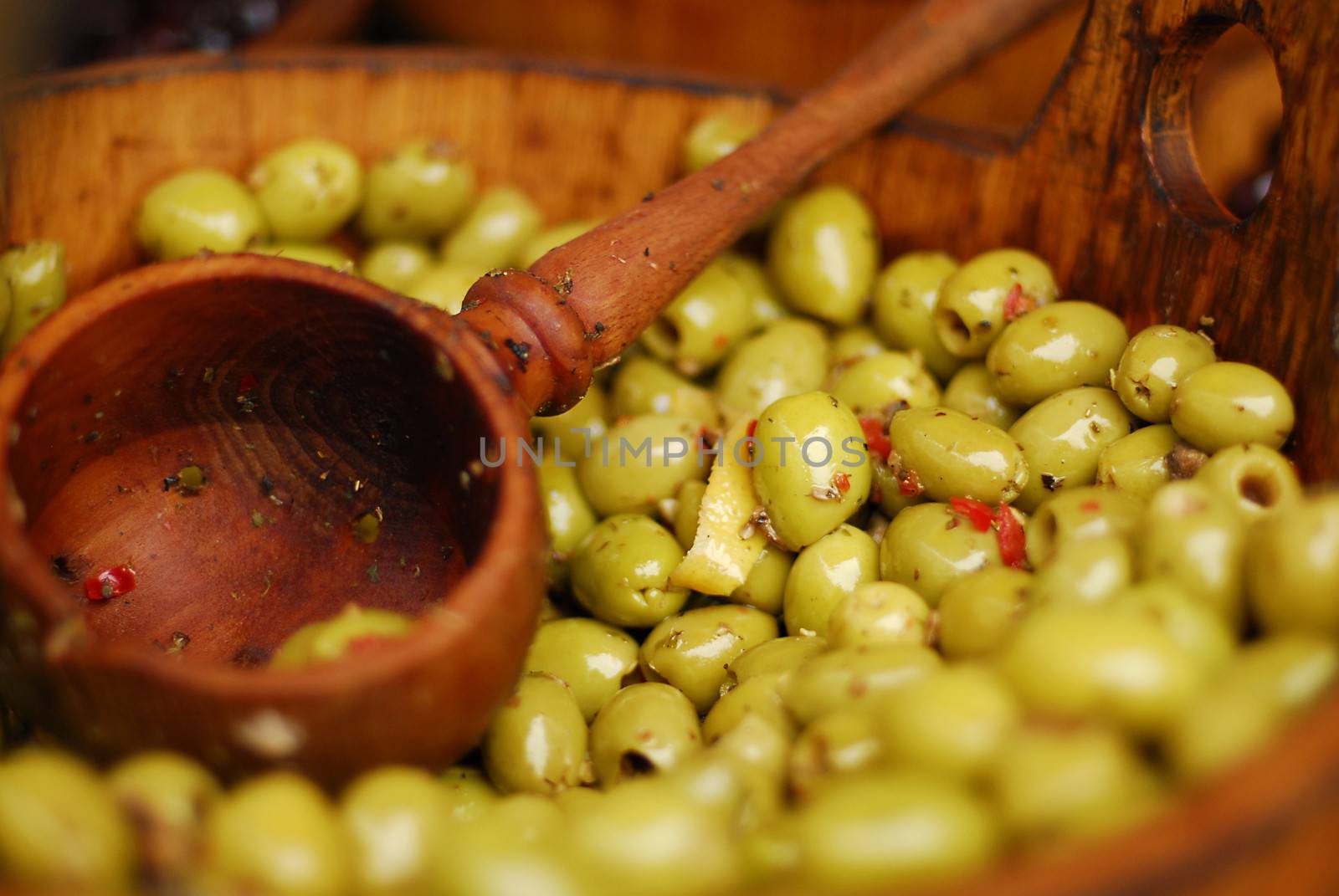 Olives being sold at a marketplace by stockyimages