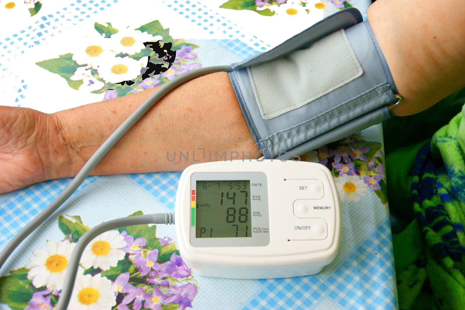Hand of the person measuring pressure by medical instrument