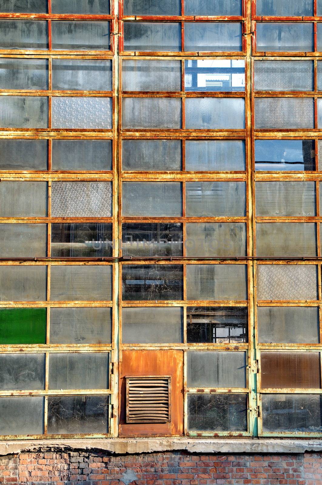 Windows of an old abandoned factory by anderm