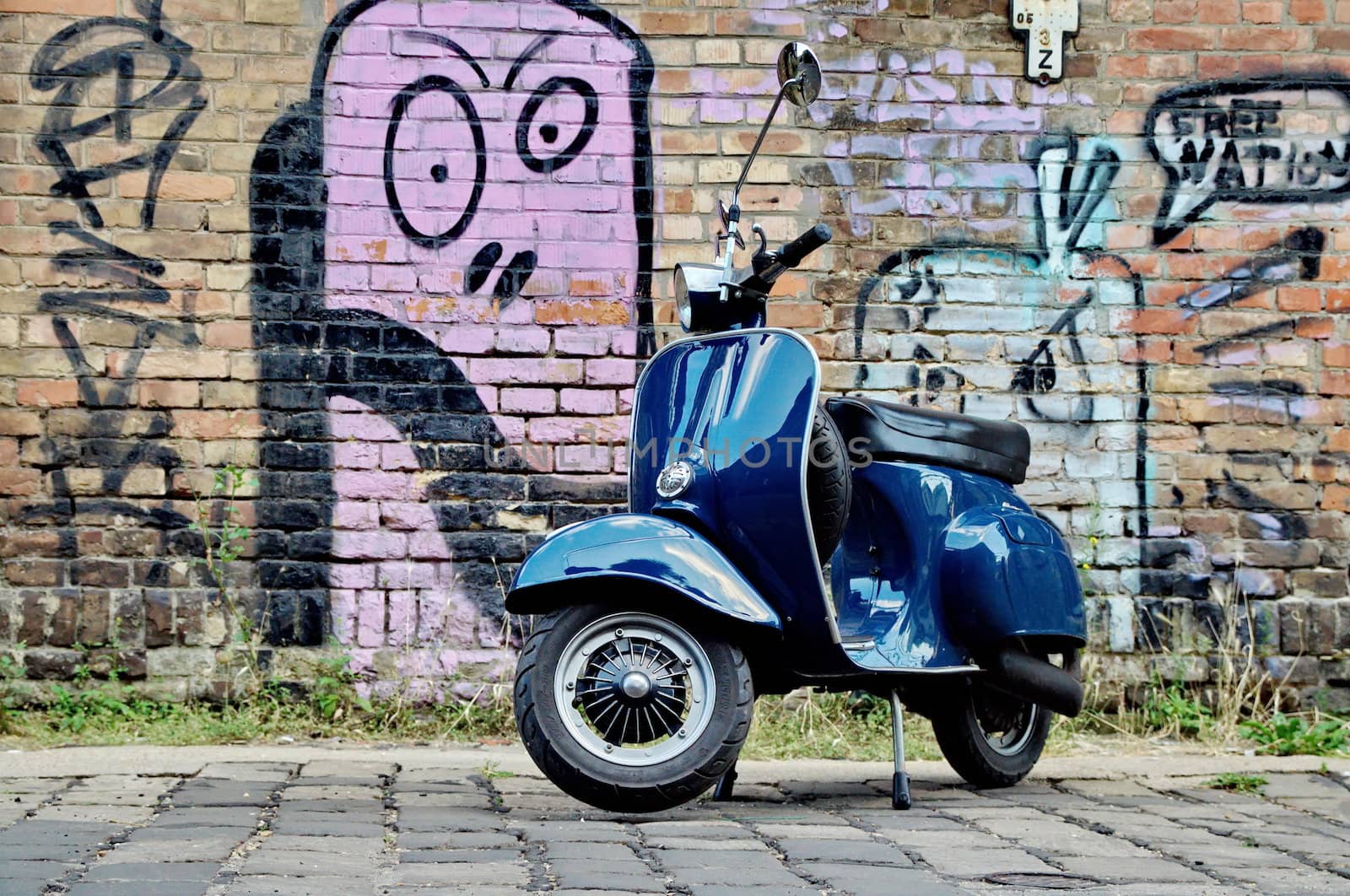 Scooter in front of a wall