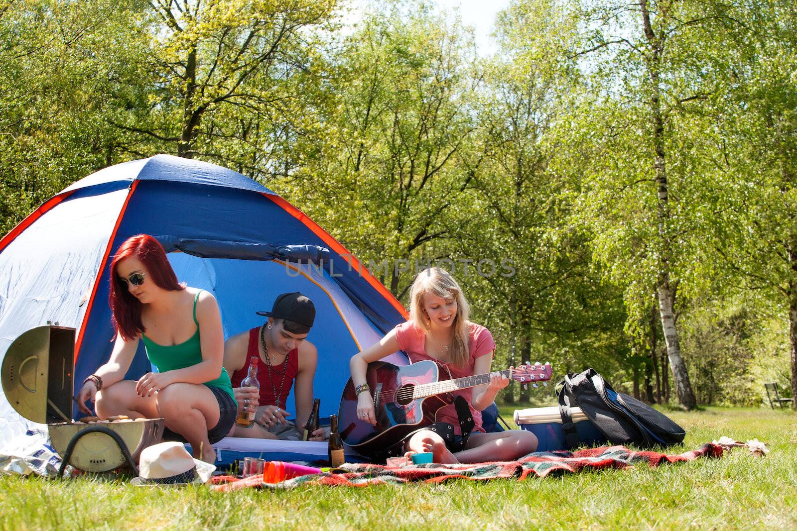 Young teenagers having a nice time on the camping by DNFStyle