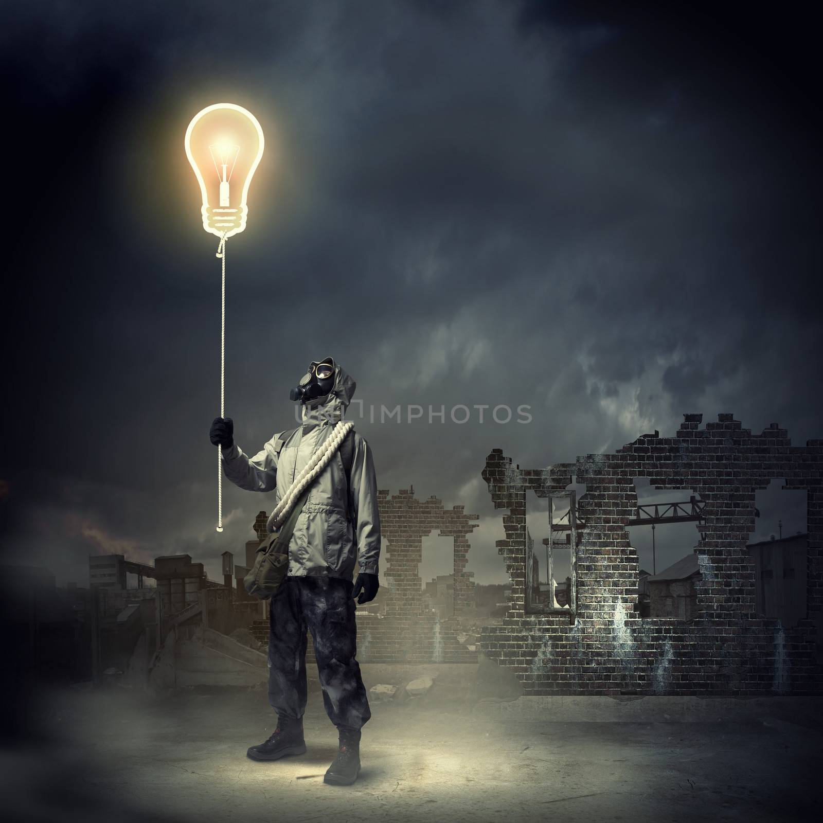 Man in respirator against nuclear background touching symbol. Pollution concept