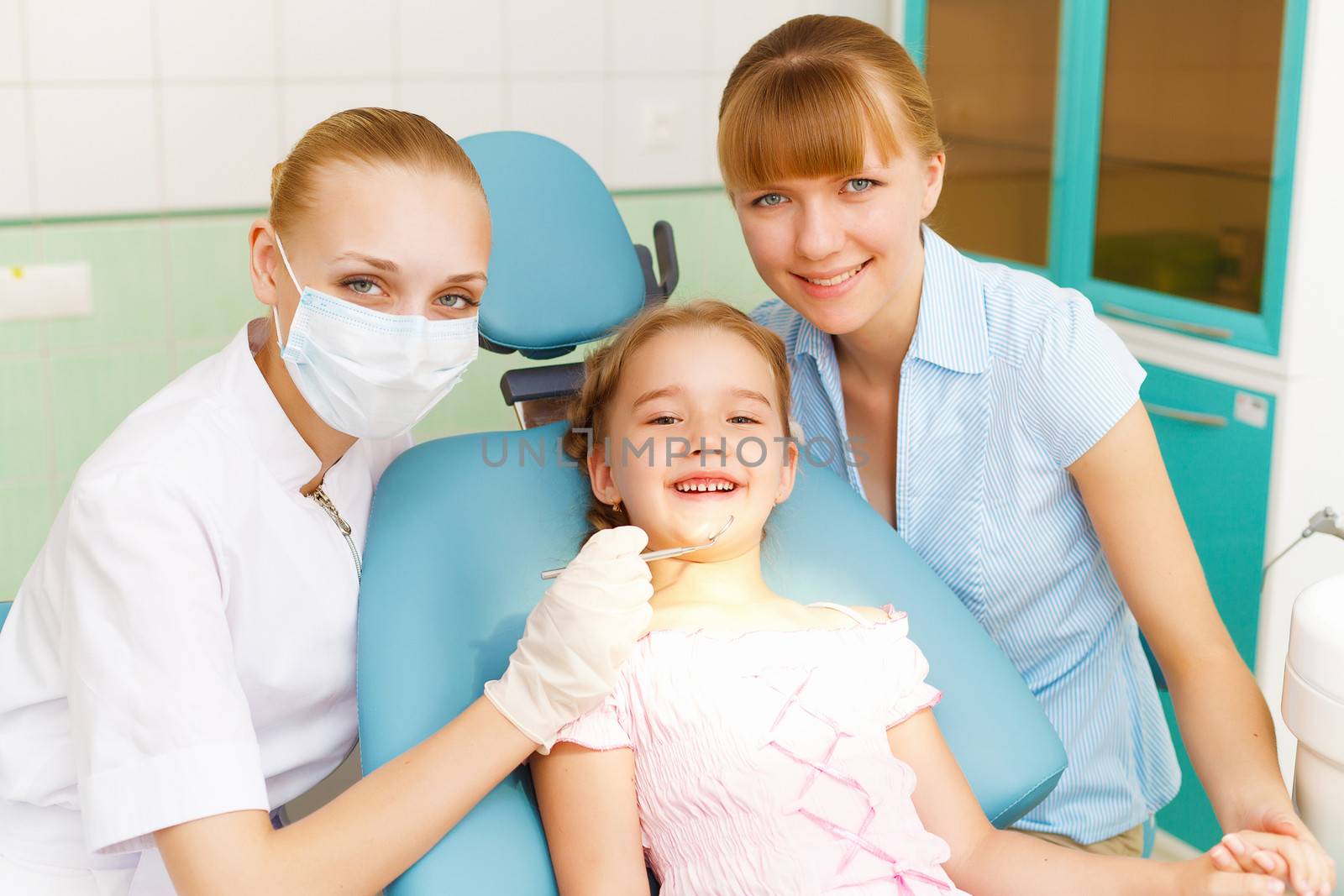 Little girl visiting dentist by sergey_nivens