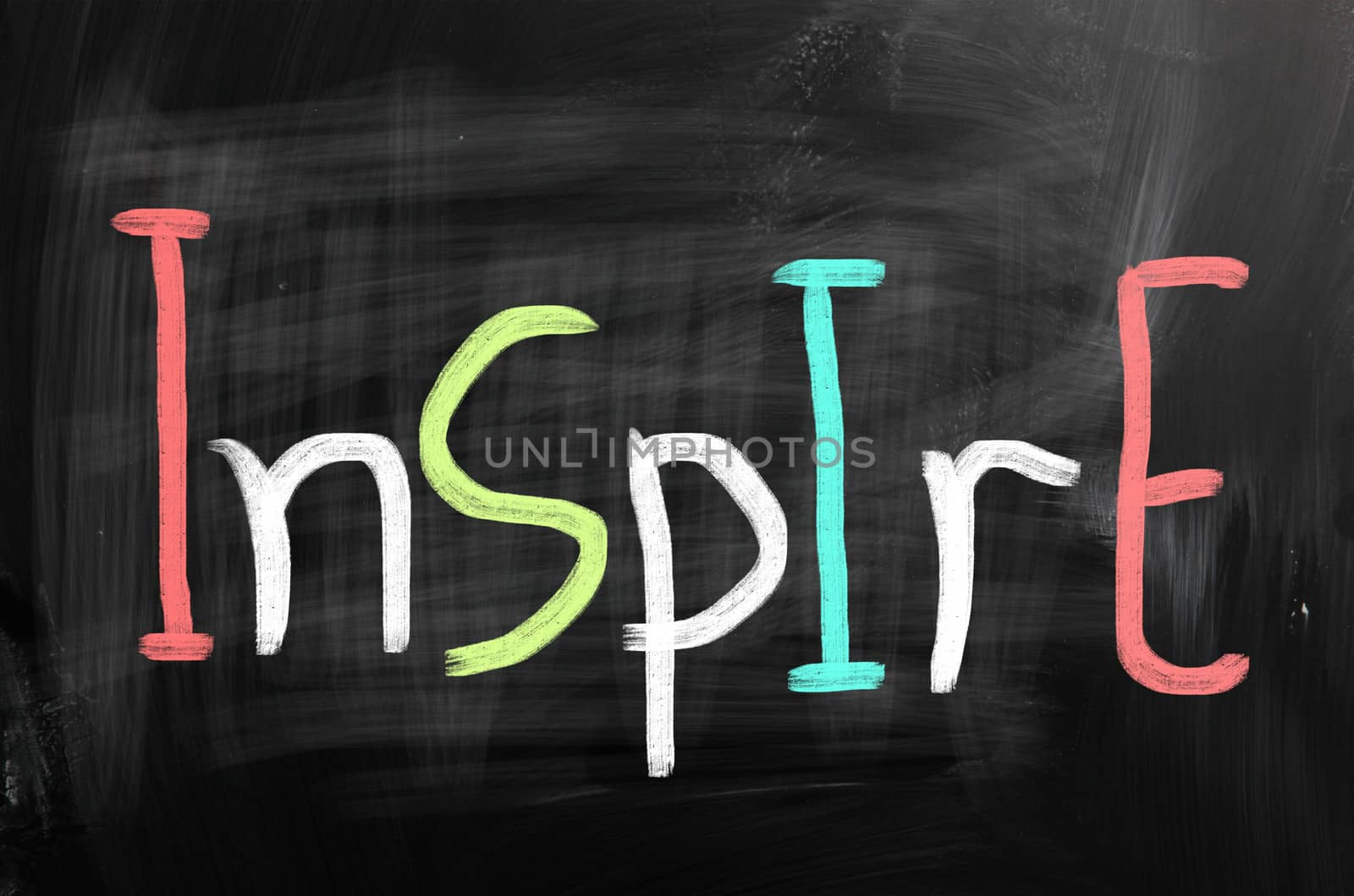 Inspire handwritten with chalk on a blackboard