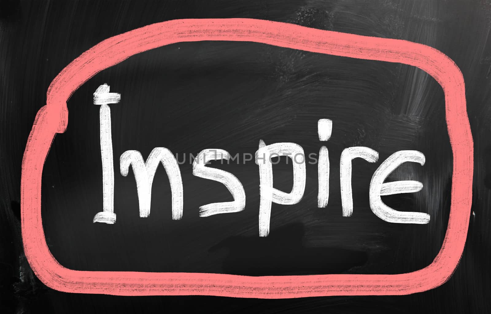Inspire handwritten with chalk on a blackboard