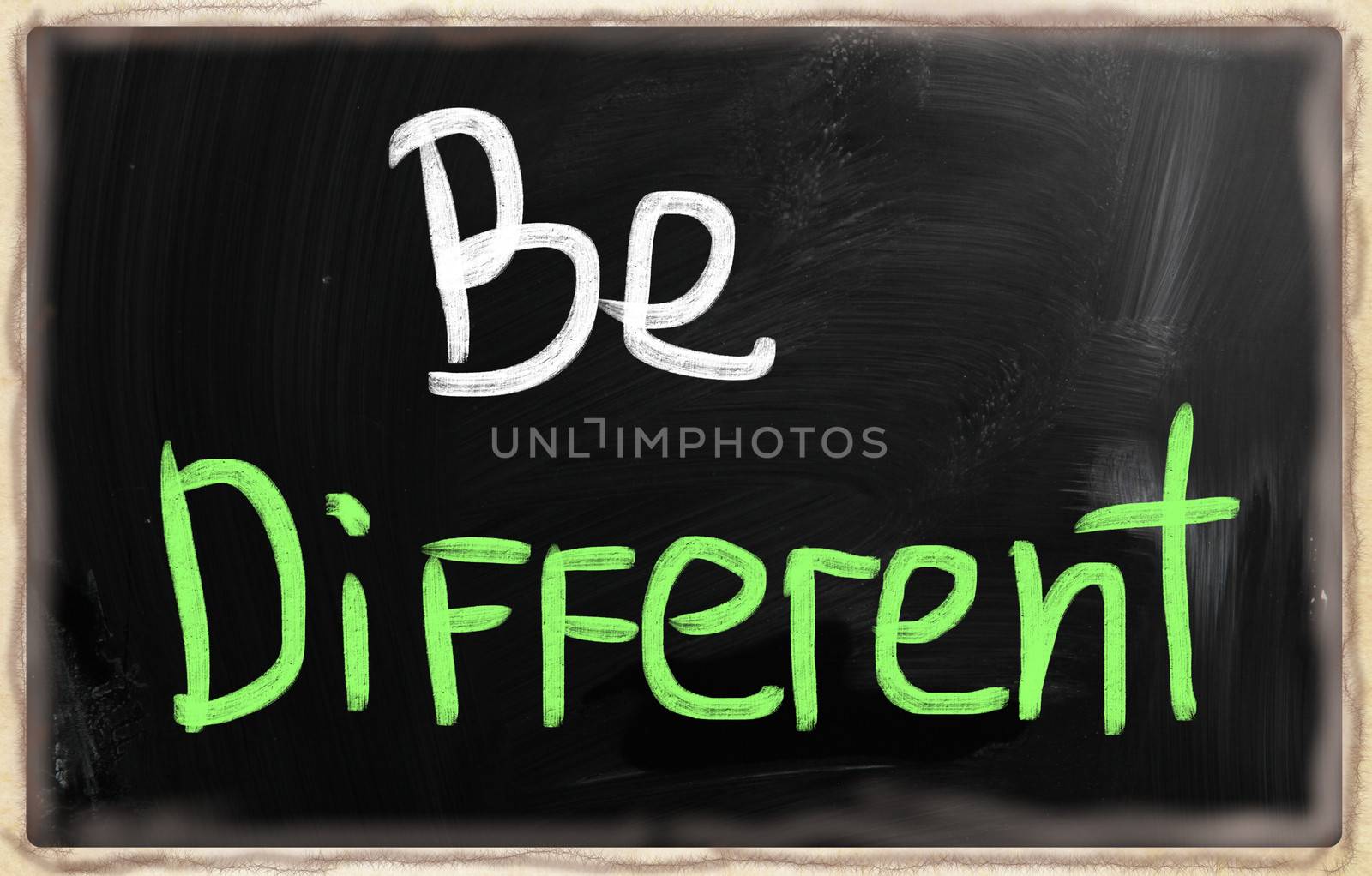 Be different handwritten with chalk on a blackboard
