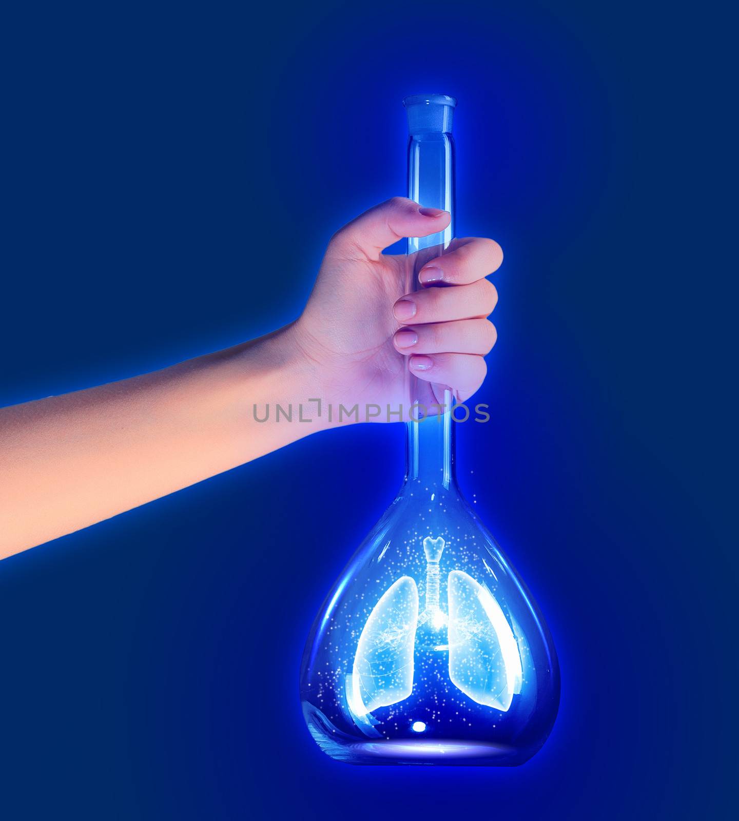Human hand holding test tube with lungs