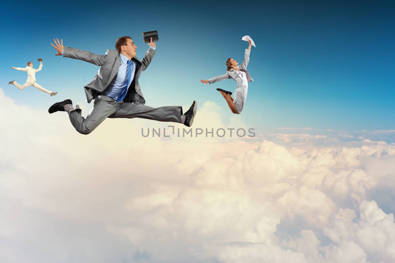 Image of businesspeople jumping high in sky