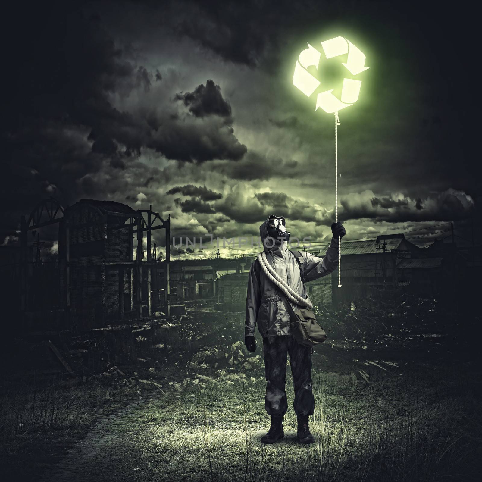 Man in respirator against nuclear background. Recycle concept