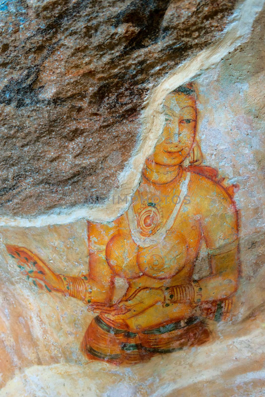 Ancient wall paintings of cloudy maiden. One of the 5th century frescoes at the ancient rock fortress of Sigiriya, Sri Lanka. 