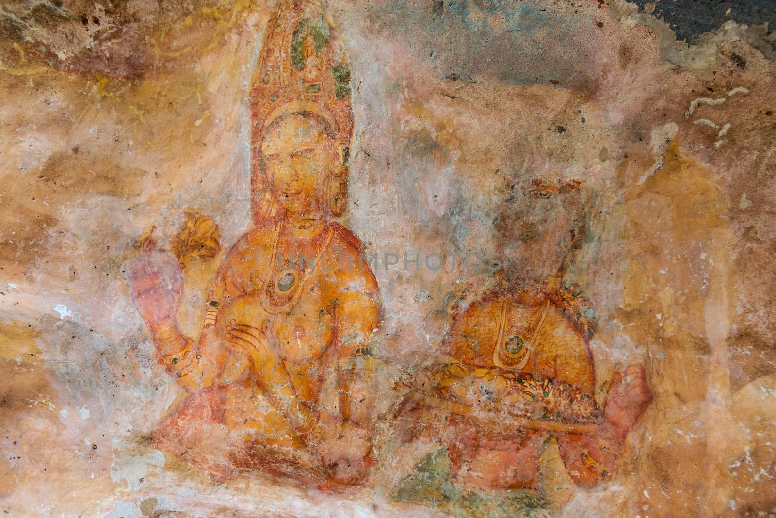 Ancient wall paintings of cloudy maidens. One of the 5th century frescoes at the ancient rock fortress of Sigiriya, Sri Lanka. 