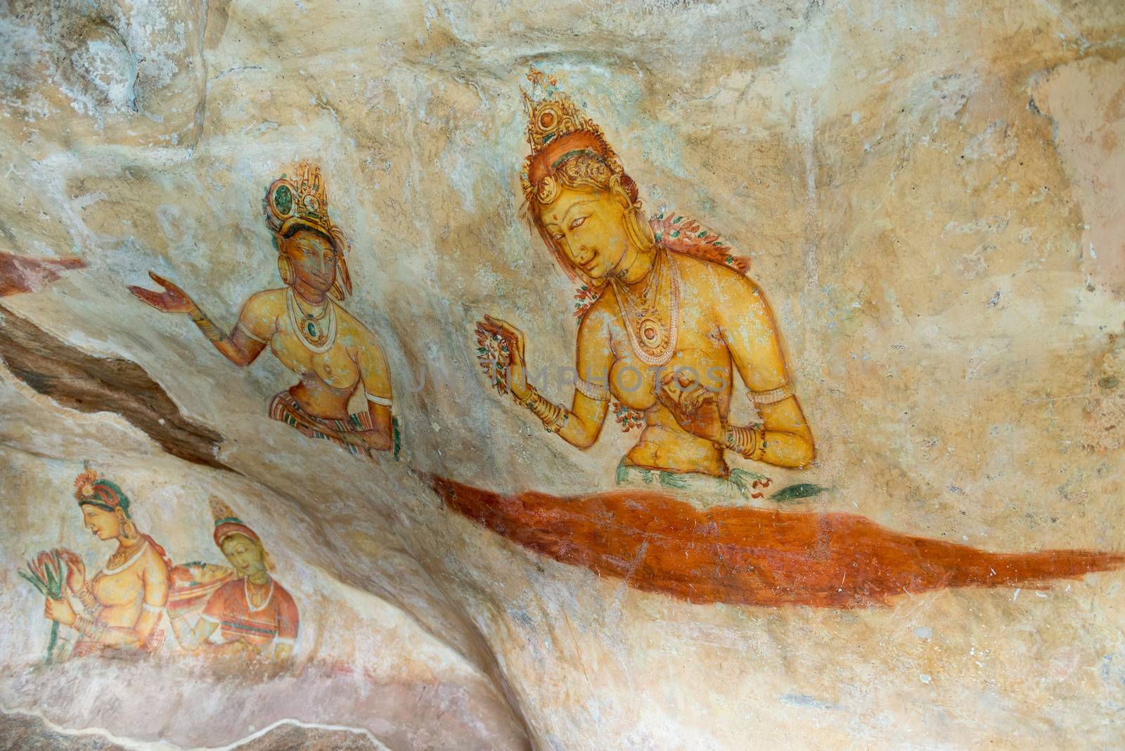 Ancient wall paintings of cloudy maidens. One of the 5th century frescoes at the ancient rock fortress of Sigiriya, Sri Lanka. 