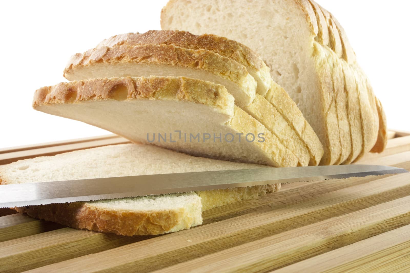 Bread chopping board with slices of white bread