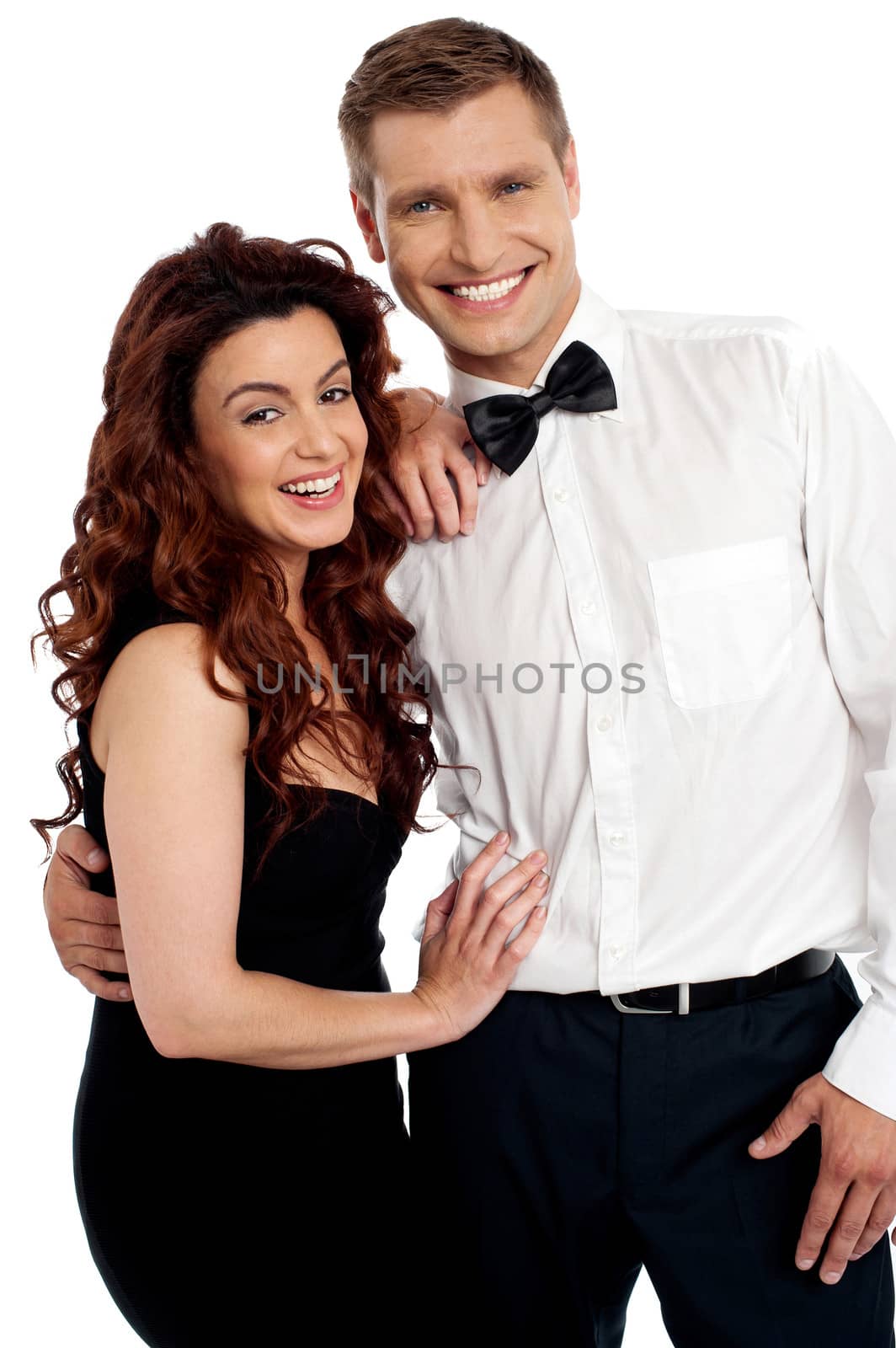 Snapshot of cheerful attractive couple embracing each other