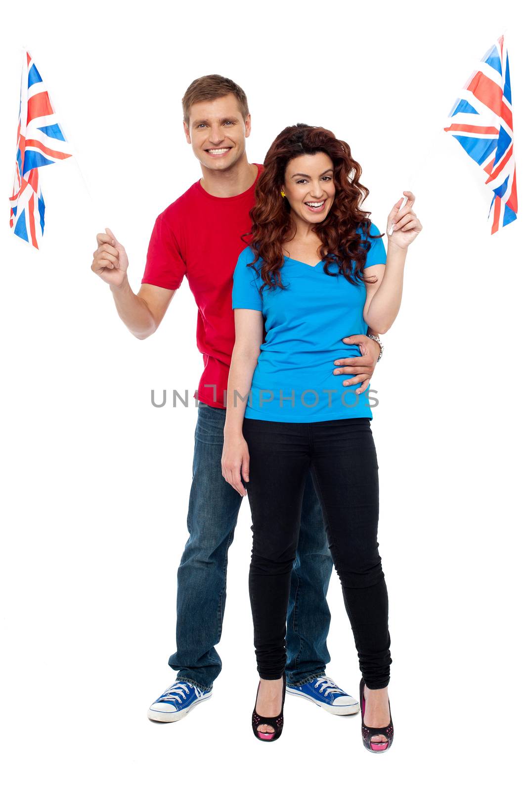 Cheerful UK supporters posing together by stockyimages