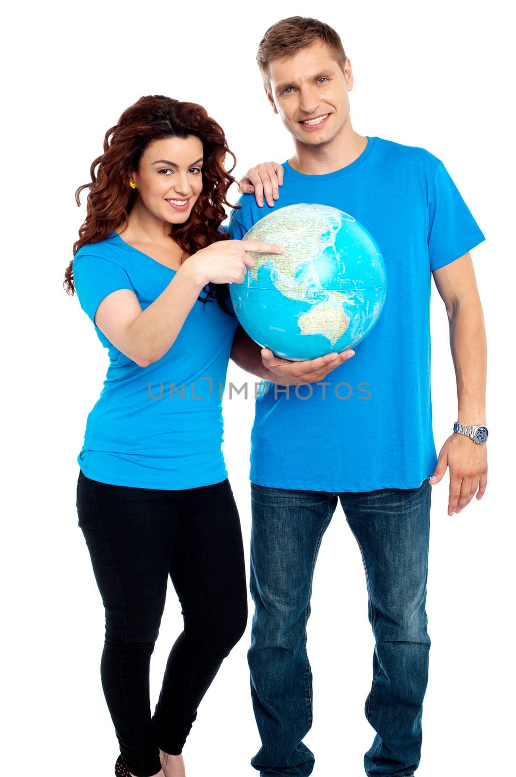 Couple posing for a picture with globe in hand. All on white background