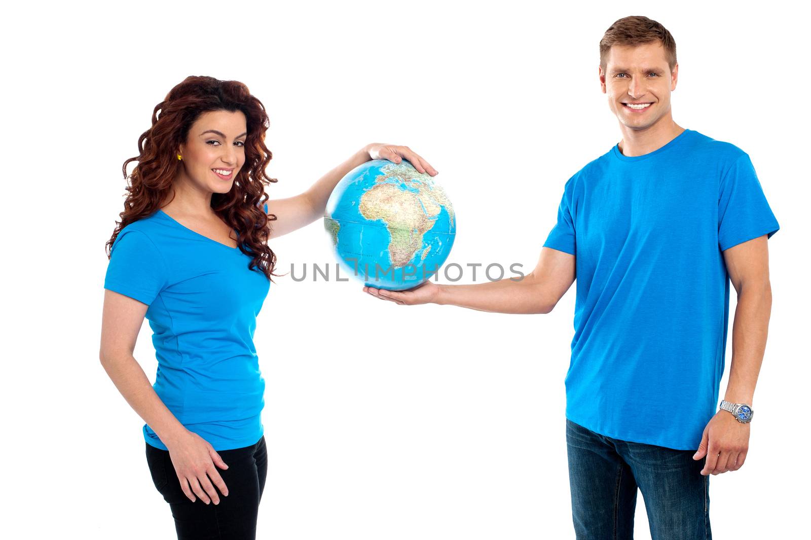 Attractive young couple holding a globe together isolated on white background